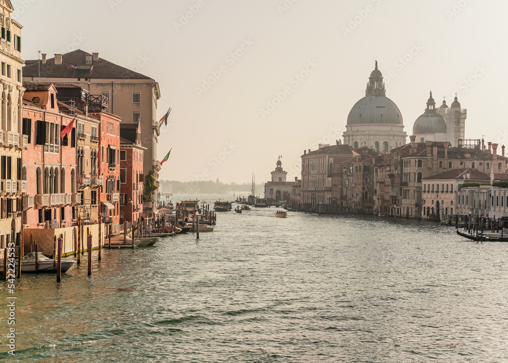 iconic view of the grand canal and church of Santa Maria della Salute in the background in Venice, Italy