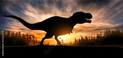 Silhouette of a tyrannosaurus rex at sunset