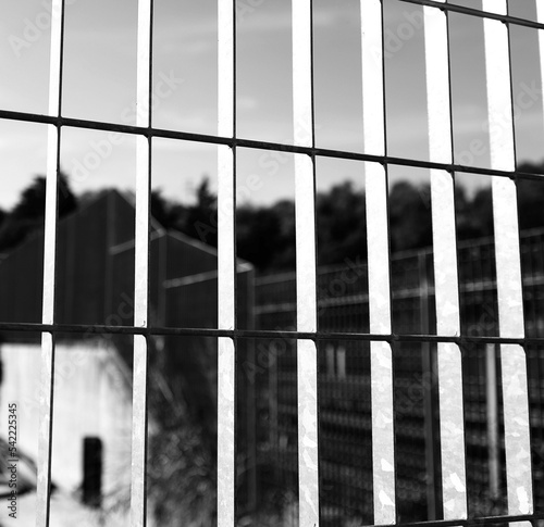 protective railing in a prison with black and white effect photo