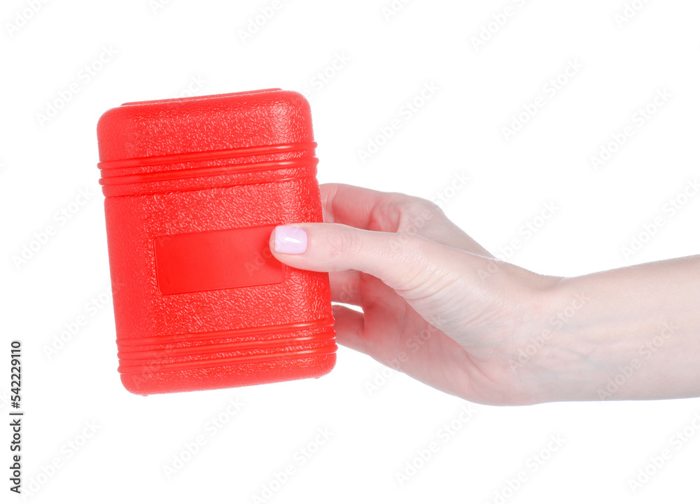 Obraz premium Red plastic box container in hand on white background isolation