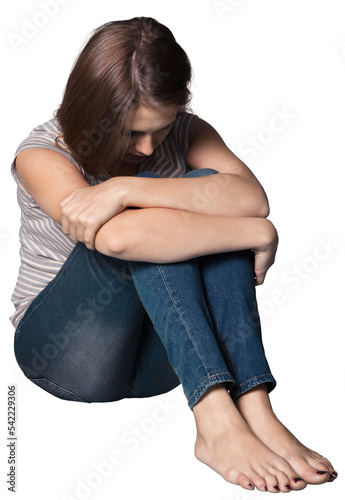 Obraz na plátne Depressed woman sitting on a chair in dark room at home