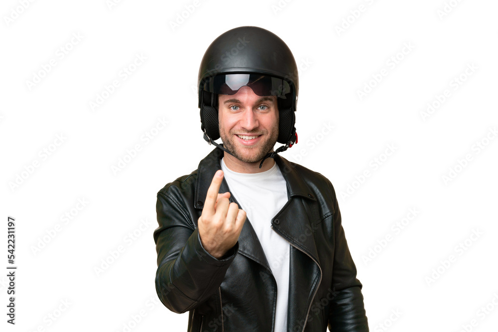 Young caucasian man with a motorcycle helmet isolated on green chroma background doing coming gesture Young caucasian man with a motorcycle helmet isolated on green chroma background doing coming gesture