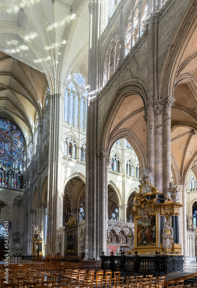 interior view of the Amiens Cathedral with the High Gothic architecture of the central and side naves