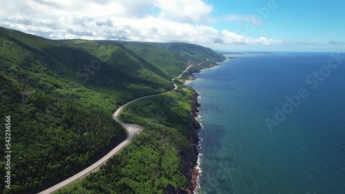 Winding cliffside road above the ocean photo