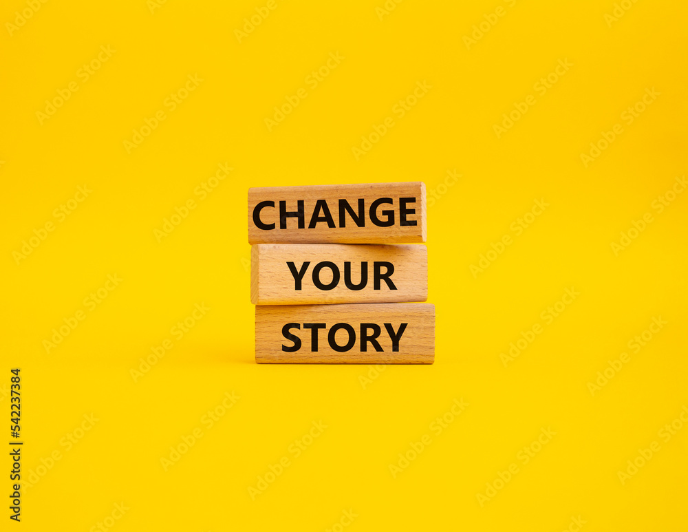 Change your story symbol. Concept word Change your story on wooden blocks. Beautiful yellow background. Business and Change your story concept. Copy space Change your story symbol. Concept word Change your story on wooden blocks. Beautiful yellow background. Business and Change your story concept. Copy space
