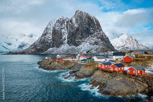 Hamnoy fishing village with red rorbu houses in Norwegian fjord in winter. Lofoten Islands, Norway photo
