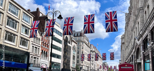 Low angle view of UK flags across The Strand, London, England, UK photo