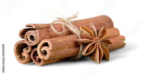 Photos Anice and cinnamon sticks on background