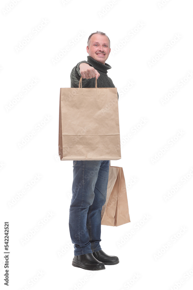 Full isolated studio picture from a man with shopping bags