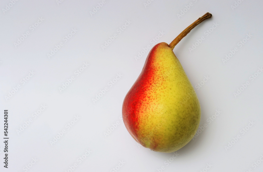 Red-yellow pear close-up on a white background. Red-yellow pear close-up on a white background.