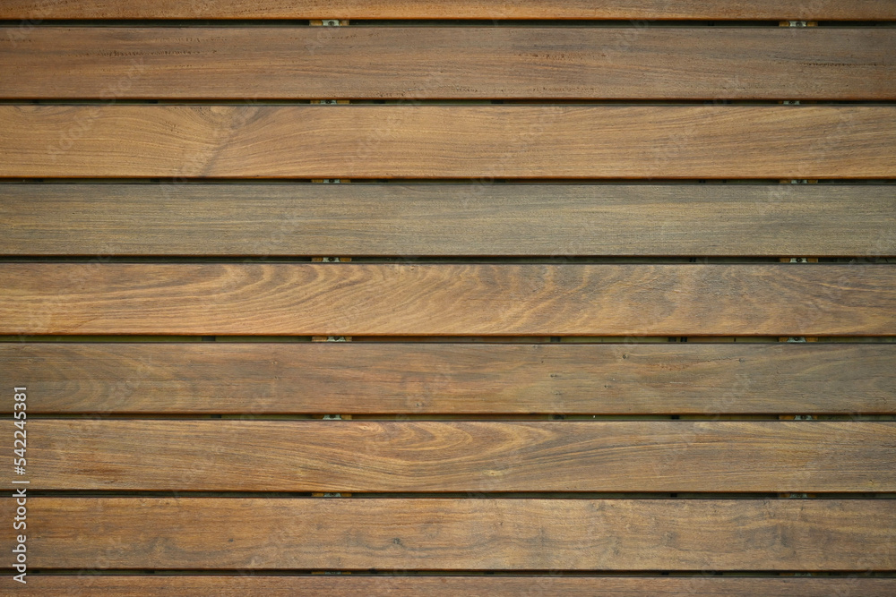 Fondo con detalle y textura de superficie de multitud de lamas de madera en tonos marrones