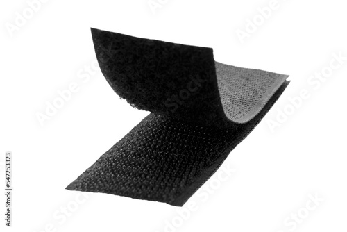 Velcro fastener for clothes isolated on white background, top view. Black velcro, top view. Contact tape isolated on white background, top view. Black velcro on a white background.