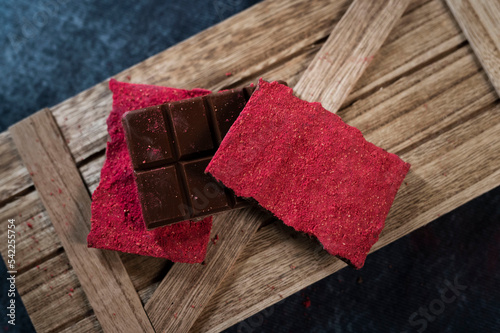 red chocolate on wooden background