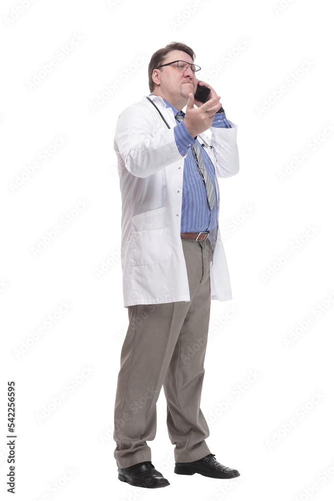 in full growth. qualified doctor with a smartphone. in full growth. qualified doctor with a smartphone.