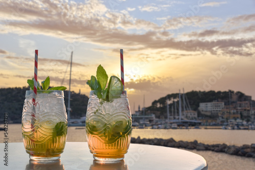 two drinks in front of a mediterranean harbor photo