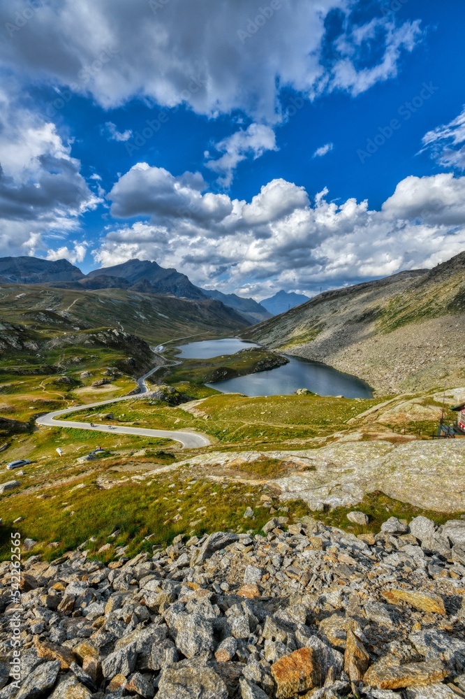 Fototapeta premium Vertical shot of the beautiful Colle del Nivolet with lake and mountains in Gran Paradiso, Italy