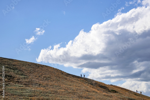 Figurines of people on the hill photo