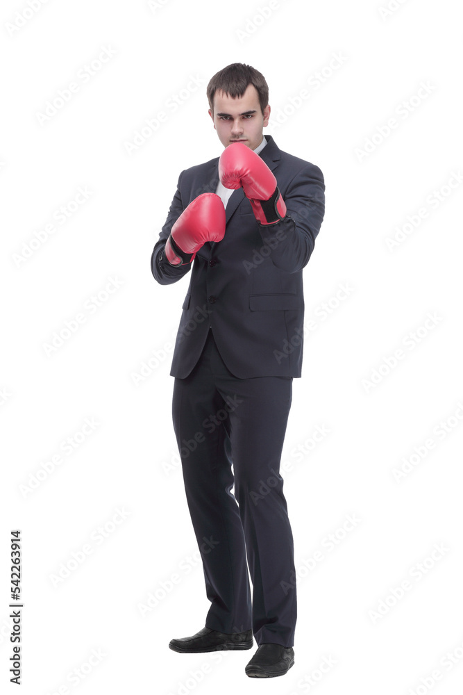 Full length portrait of a young businessman in suit with red boxing gloves Full length portrait of a young businessman in suit with red boxing gloves