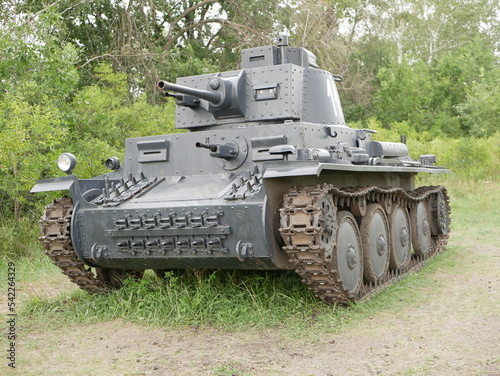 Czechoslovak light tank of the Second World War, which was in service with the Wehrmacht. A tank painted dark gray on a forest road.