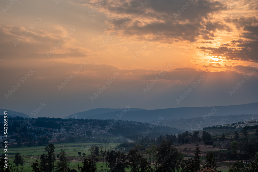 A view of the sun setting over the hills in Kigali, Rwanda