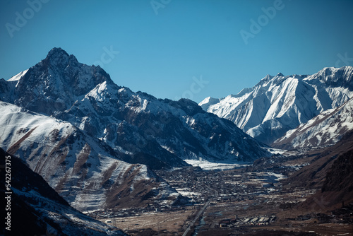 Caucasian mountains covered with snow on a sunny day