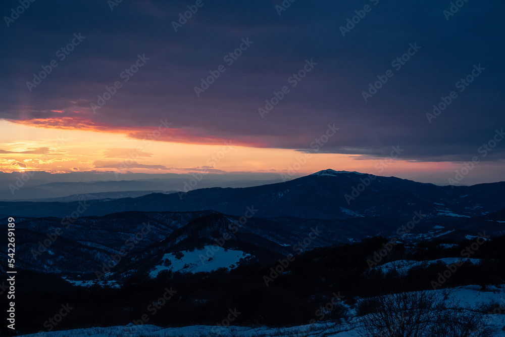 sunset in the snowy mountains