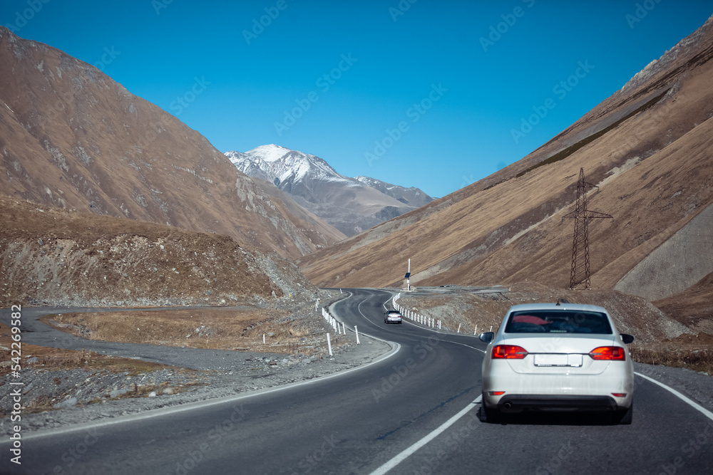 car driving on the road in the mountains