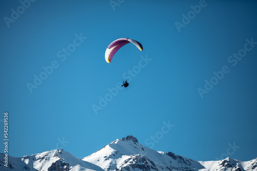 paragliding in winter in the mountains