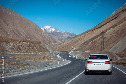 car driving on the road in the mountains