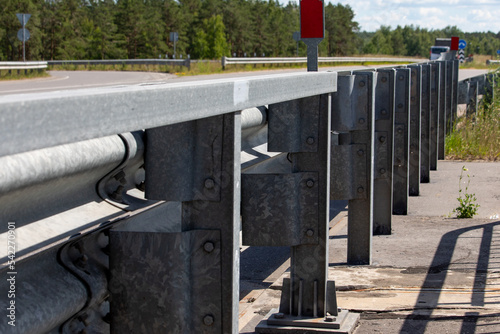 Fences along the motorway road. Road interchanges.