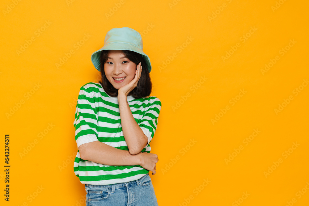 Asian young woman wearing panama smiling and looking at camera Asian young woman wearing panama smiling and looking at camera