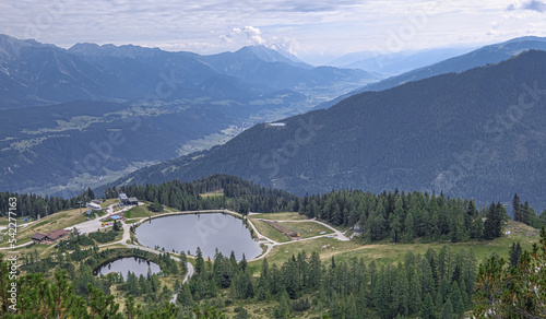 View of Rieteralm , Riteralm lake and the surroundings as seen from Gasselhohe summit (2001 m), located near Shladming, Schaladming-Dachstein, Styria, Austria photo