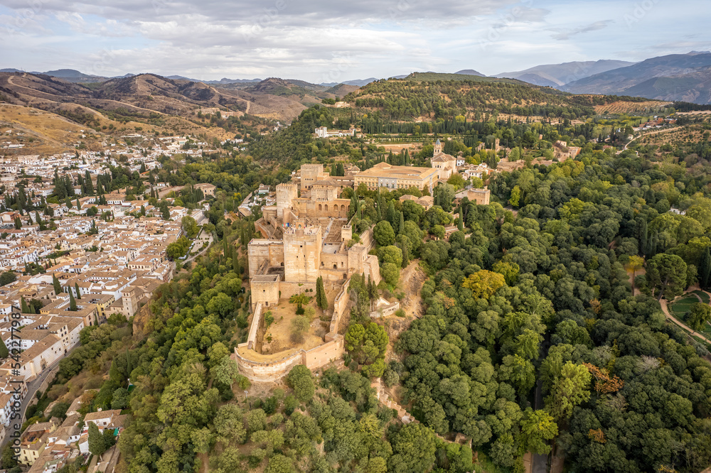 The drone aerial view of famous Alhambra de Granada, Andalusia, Spain. The Alhambra is a palace and fortress complex located in Granada.