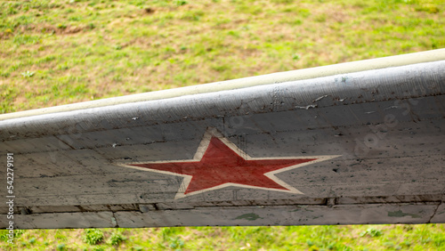 Фотография Identification mark of the Air Force of the Russian Federation, a five-pointed red star, bordered by a white stripe on an old Soviet passenger or military transport aircraft from the Second World War