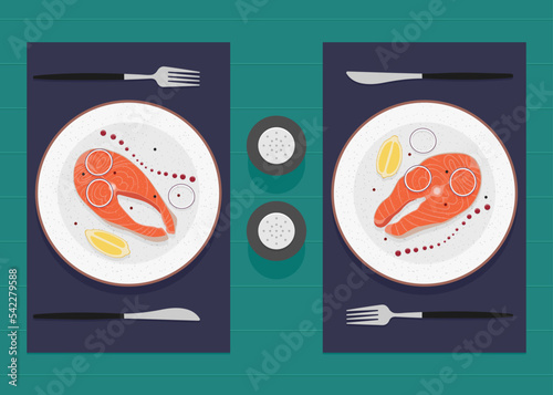 Delicious Dinner or Lunch for two. Red fish with onion, lemon and sauce on the table