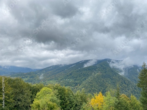 beautiful autumn mountain landscape with rain clouds