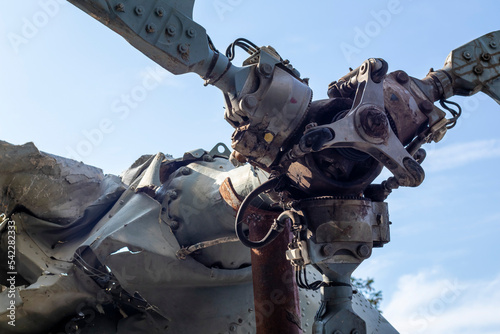Burnt parts of the destroyed Russian Air Force combat helicopter Hind Crocodile. The wreckage of a downed helicopter. War in Ukraine. Broken military attack helicopter close-up.