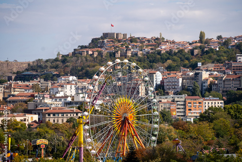 Amusement Park in the City and Historical Castle in the Background