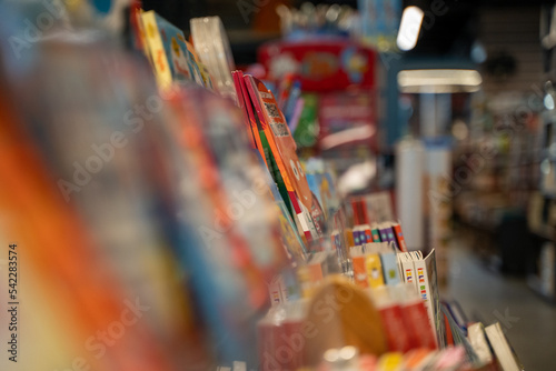 Kids Coloring Books in Bookstore and Blurred Background