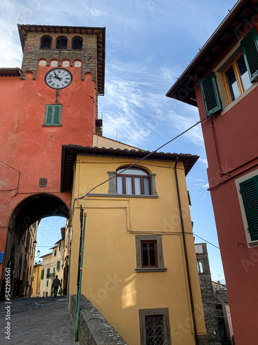 Loro Ciuffenna, Tuscany, Italy. Loro Ciuffenna village street view. Torre dell'orologio at via Dante Alighieri. Loro Ciuffenna is a comune in the Province of Arezzo in the Italian region  photo