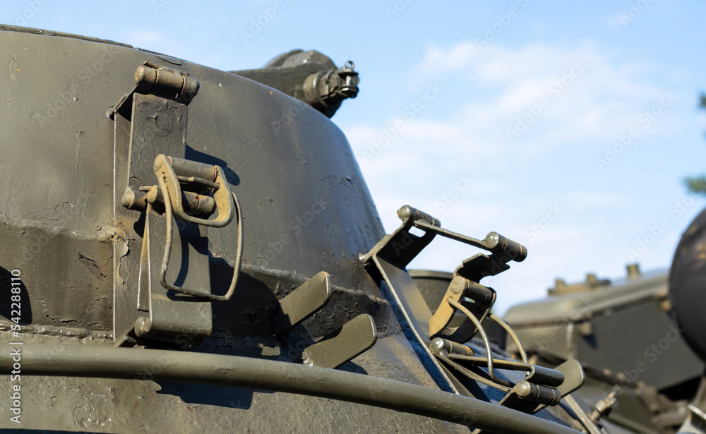 Tower of an armored personnel carrier or tank. Heavy weapons of war, sky background. Army equipment for combat and defense. Cannon tower. Details of military equipment. Close-up. Tower of an armored personnel carrier or tank. Heavy weapons of war, sky background. Army equipment for combat and defense. Cannon tower. Details of military equipment. Close-up.
