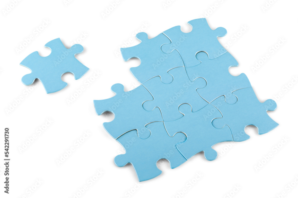 Fitting last puzzle piece on white background Fitting last puzzle piece on white background