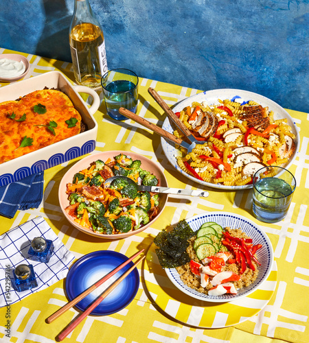 Summer picnic spread with four dishes and wine