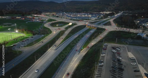 Aerial, drone, evening video of a diverging diamond interchange (DDI), at normal speed, located in Woodbury, NY. photo