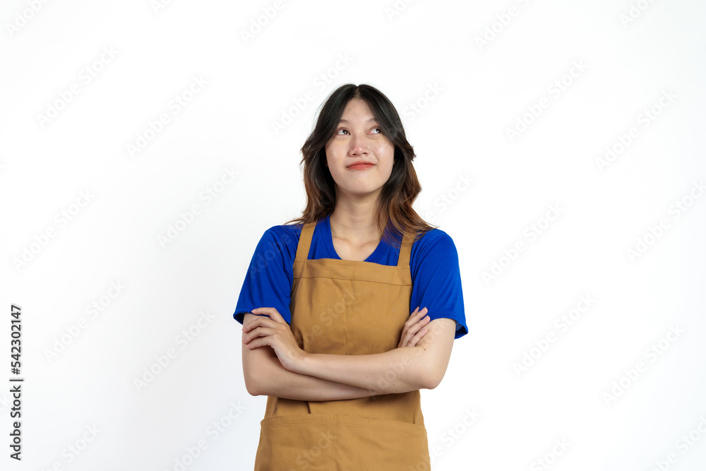 Cheerful young pretty asian woman blue t-shirt and apron coffee owner isolated on white background. Cheerful young pretty asian woman blue t-shirt and apron coffee owner isolated on white background.