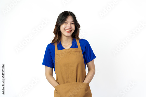 Cheerful young pretty asian woman blue t-shirt and apron coffee owner isolated on white background. looking camera