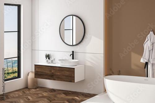 Modern bathroom interior with beige walls  white sink with oval mirror  bathtub and parquet floor. Minimalist bright bathroom with modern furniture. Side view.3D rendering