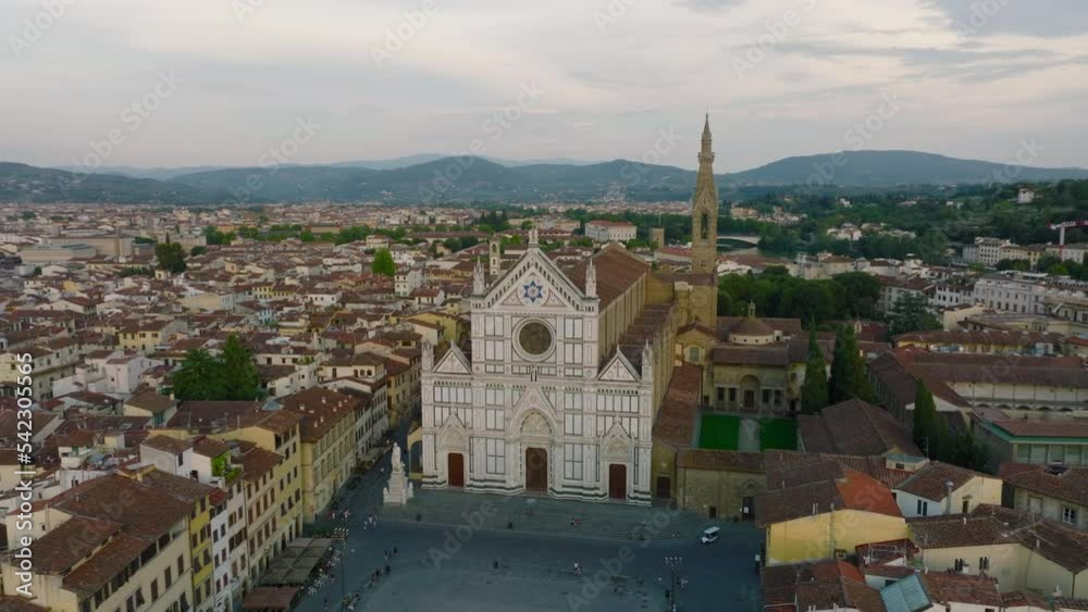 Aerial shot of amazing marble facade of large Basilica di Santa Croce. Historic city centre of famous tourist destination at twilight. Florence, Italy Aerial shot of amazing marble facade of large Basilica di Santa Croce. Historic city centre of famous tourist destination at twilight. Florence, Italy