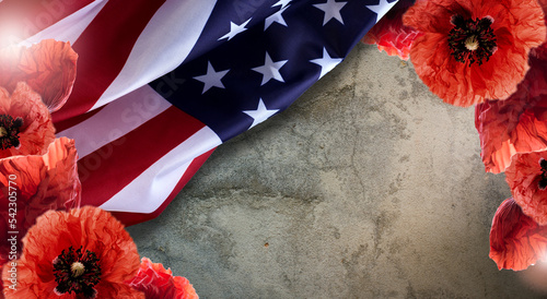 Remembrance day banner with red poppy flowers against the rough background. Memorial for victims of World war