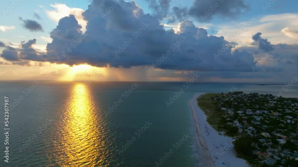 Aerial drone view of sunset over the Gulf of Mexico seen from Anna Maria Island, Florida.